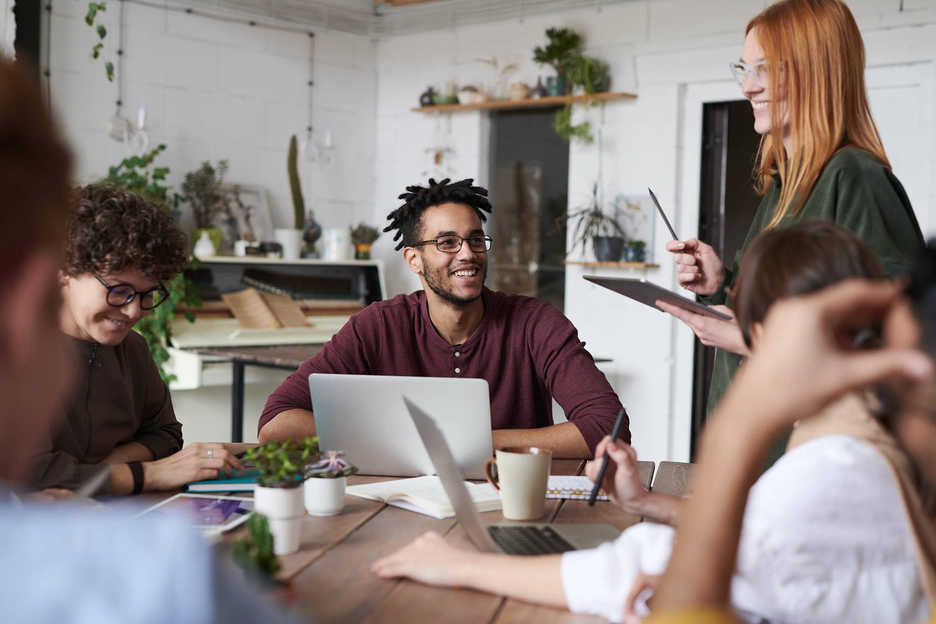 A remote accounting team discussing financials with a painting contractor.